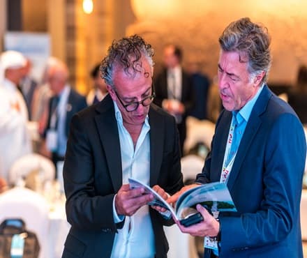 Maritime professionals discussing AI adoption